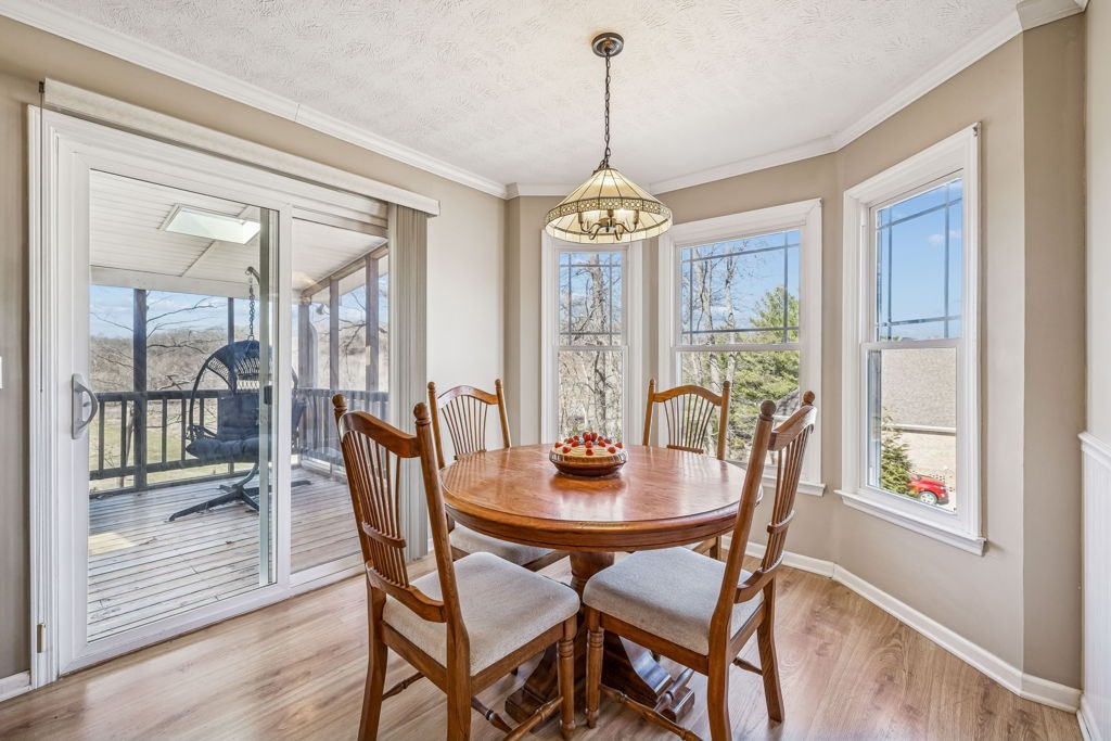 1728 Riverhaven Drive Adams, TN 37010 - Photo 26 of 75 a view of a dining room with furniture wooden floor and chandelier