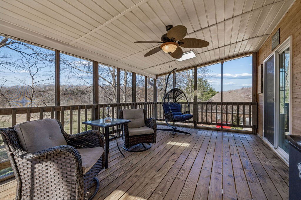 1728 Riverhaven Drive Adams, TN 37010 - Photo 28 of 75 a view of a balcony with furniture and wooden floor
