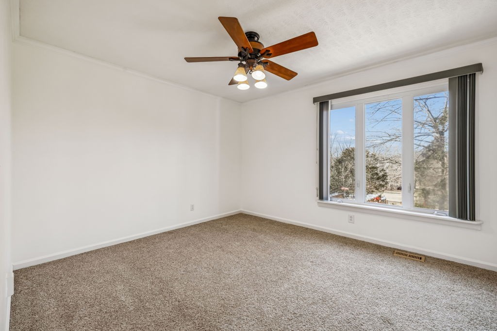 1728 Riverhaven Drive Adams, TN 37010 - Photo 30 of 75 an empty room with a window and a fan