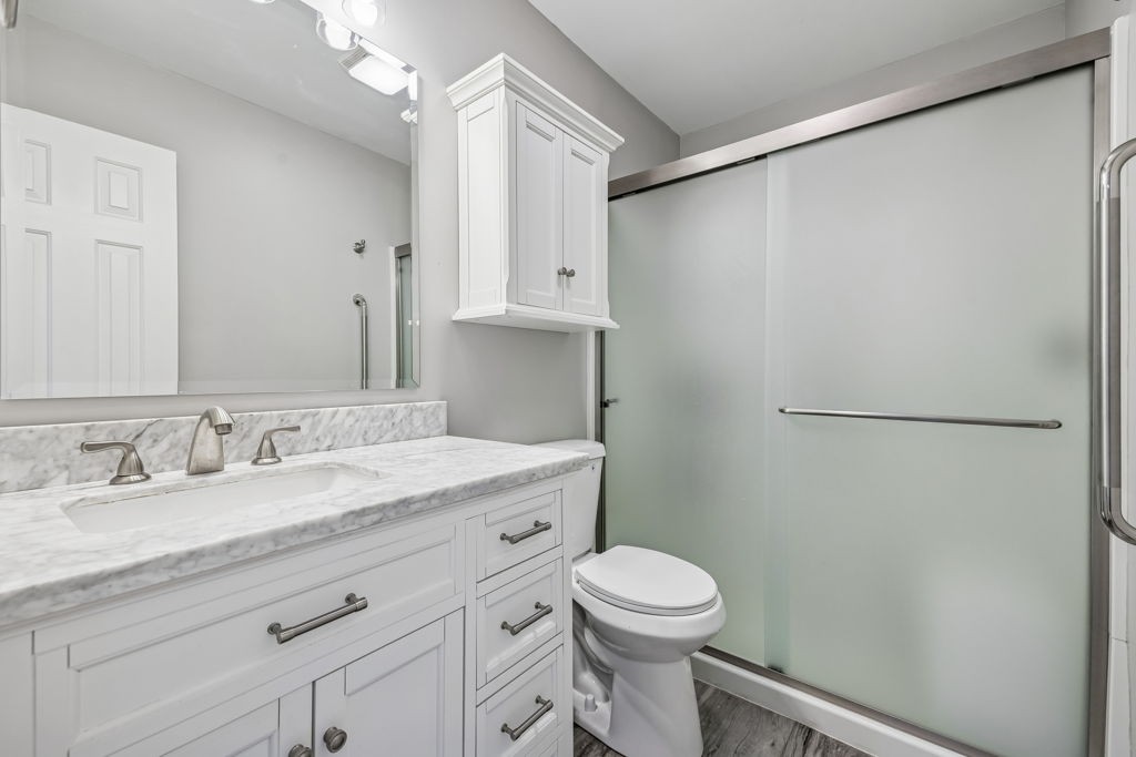 1728 Riverhaven Drive Adams, TN 37010 - Photo 33 of 75 a bathroom with a granite countertop sink toilet and shower