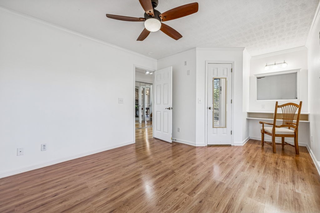 1728 Riverhaven Drive Adams, TN 37010 - Photo 36 of 75 a view of a livingroom with wooden floor and a ceiling fan