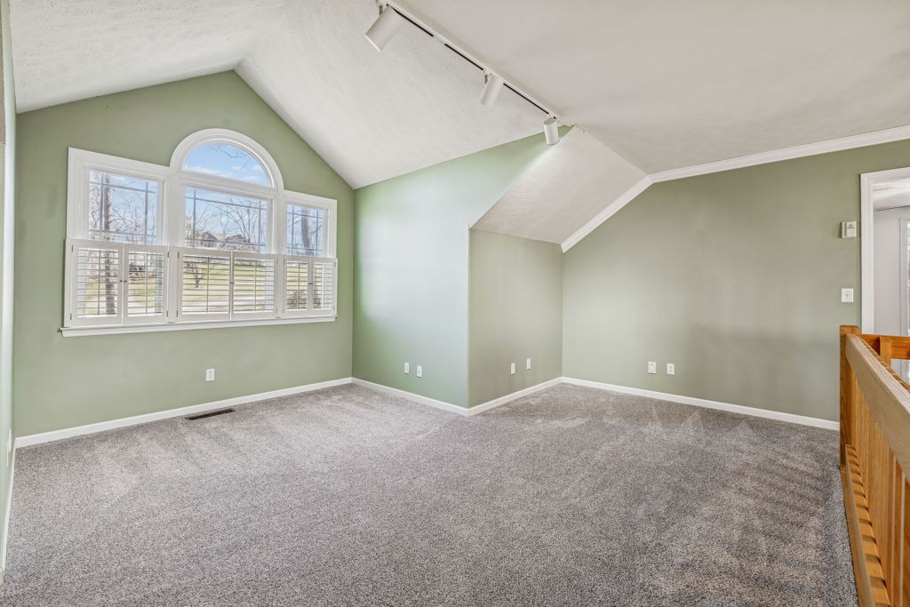 1728 Riverhaven Drive Adams, TN 37010 - Photo 39 of 75 an empty room with windows and chandelier fan