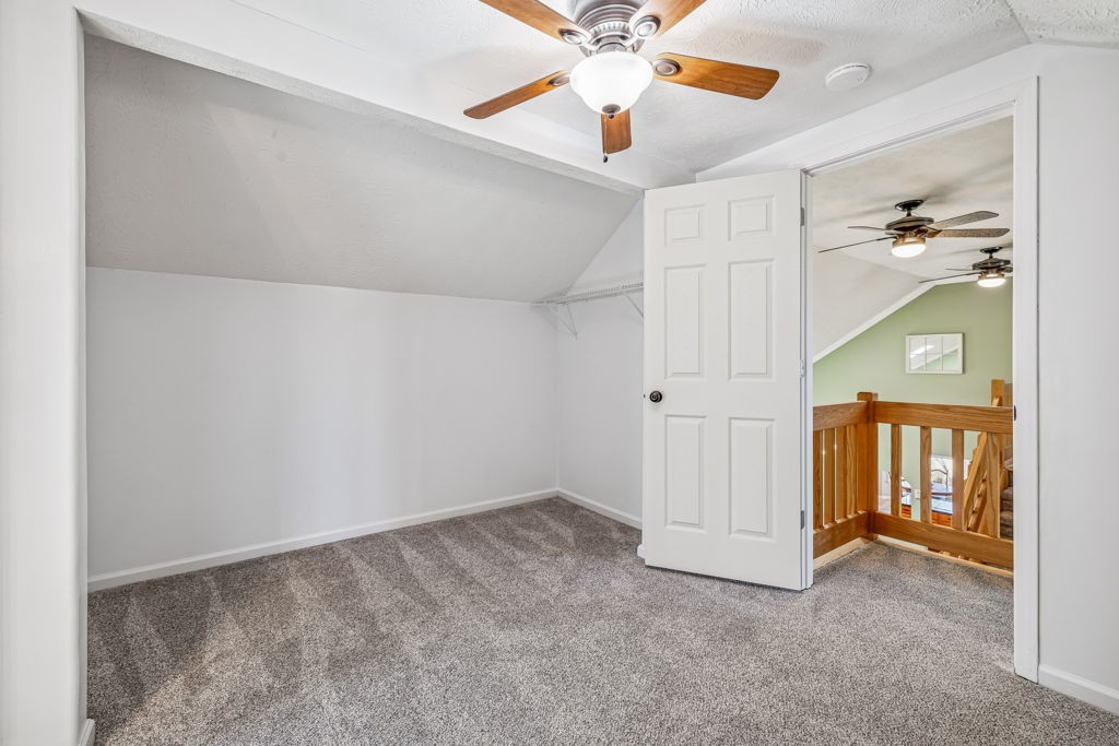 1728 Riverhaven Drive Adams, TN 37010 - Photo 41 of 75 an empty room with closet and a chandelier fan