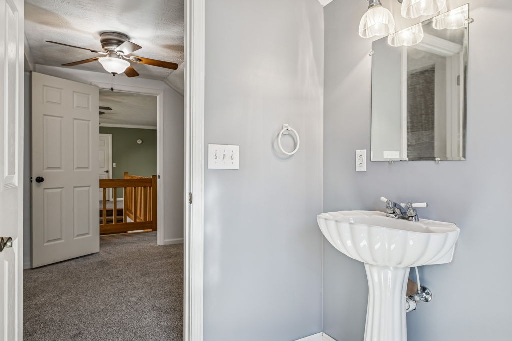1728 Riverhaven Drive Adams, TN 37010 - Photo 43 of 75 a bathroom with a sink a light fixture and a mirror