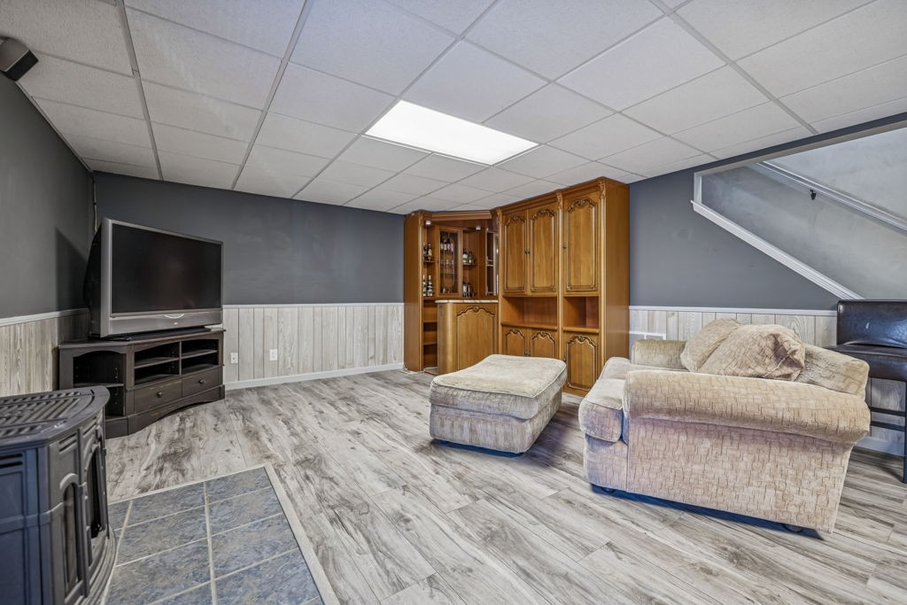 1728 Riverhaven Drive Adams, TN 37010 - Photo 48 of 75 a living room with furniture and a flat screen tv