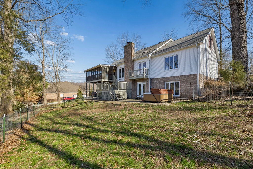 1728 Riverhaven Drive Adams, TN 37010 - Photo 59 of 75 a view of a big house with a big yard and large tree