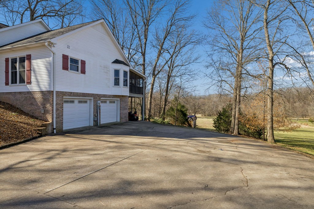 1728 Riverhaven Drive Adams, TN 37010 - Photo 6 of 75 a view of road with large trees