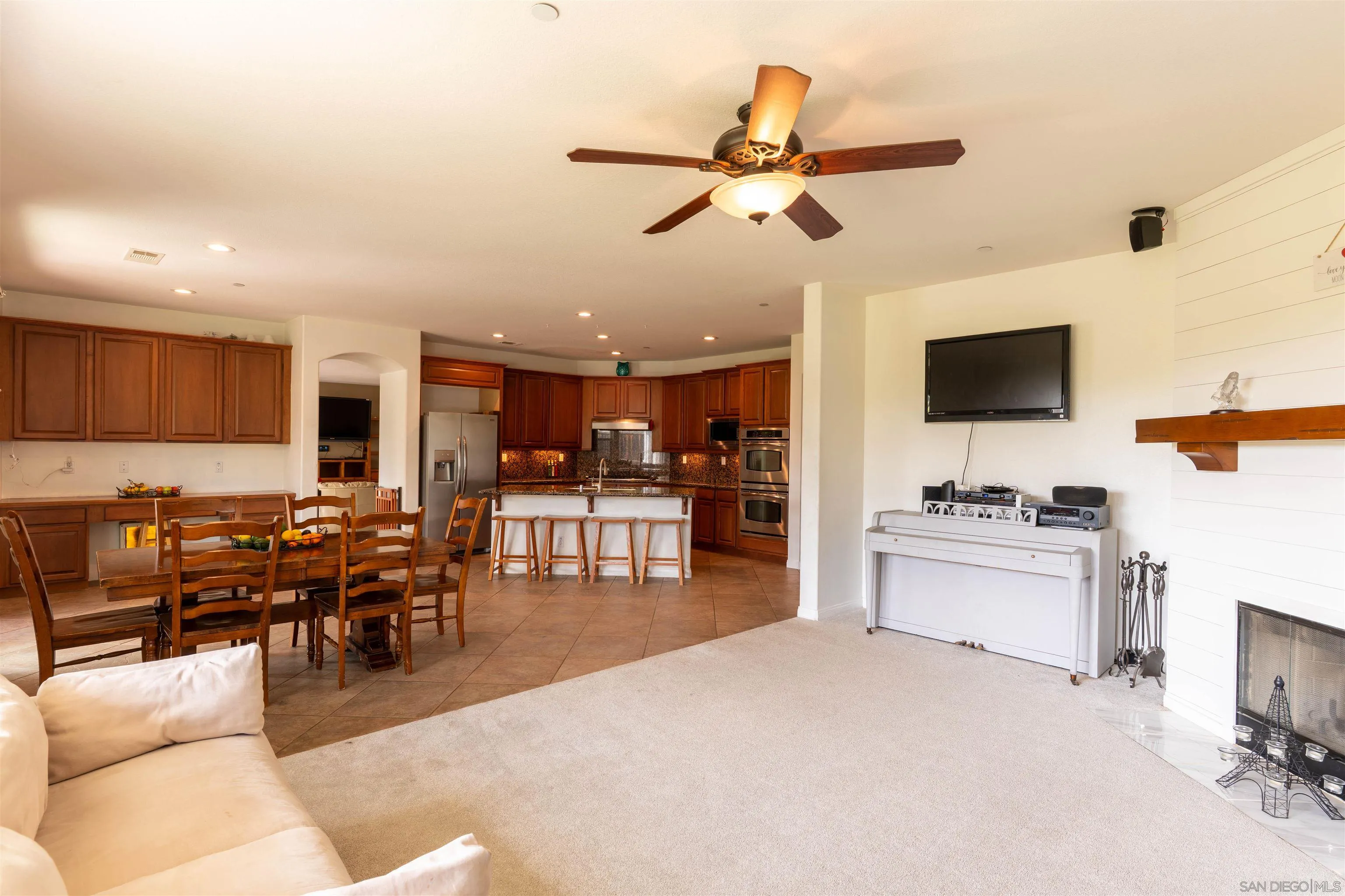 2352 Clearcrest Lane Fallbrook, CA 92028 - Photo 12 of 33 a living room with furniture kitchen view and a flat screen tv