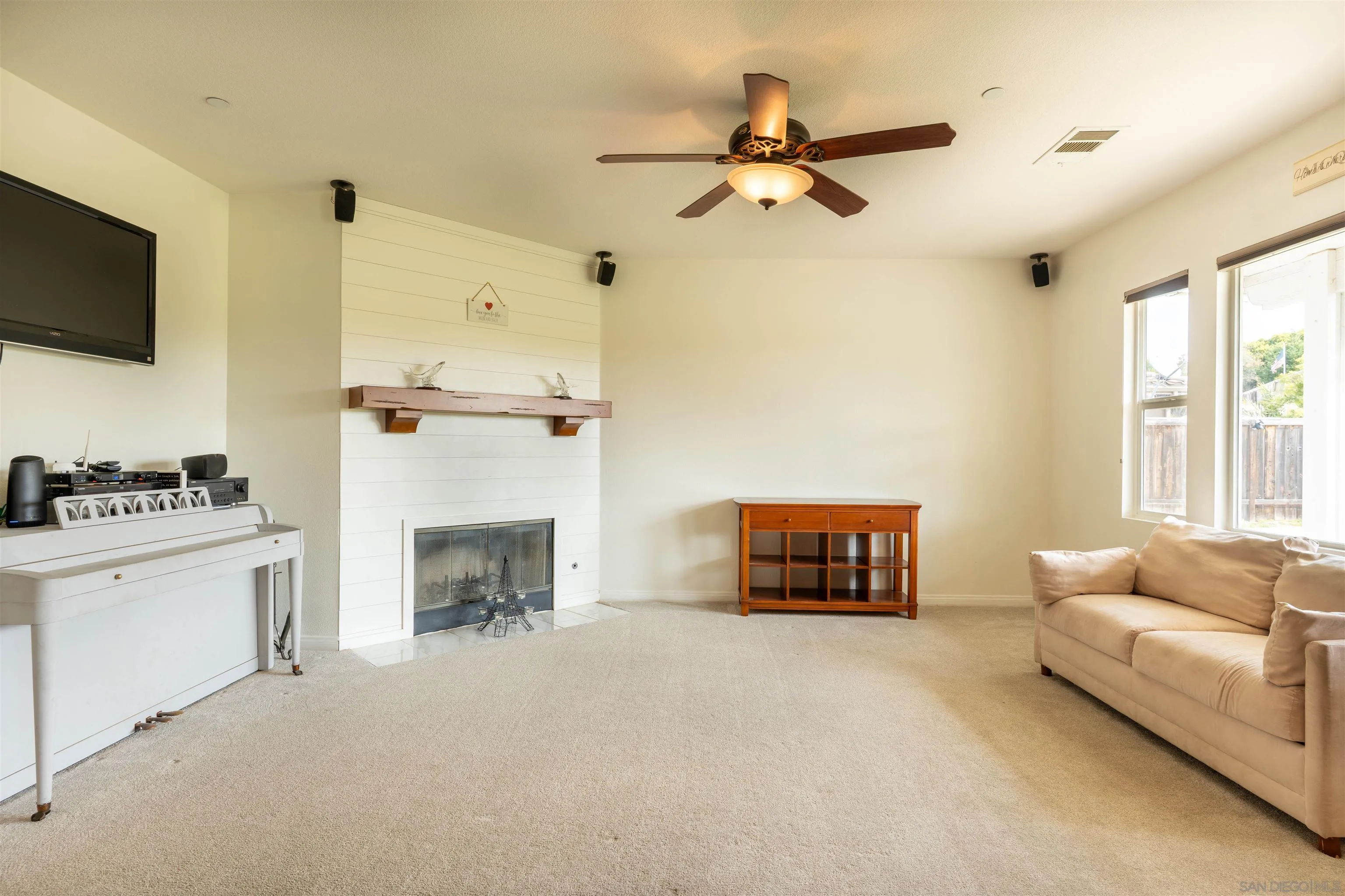 2352 Clearcrest Lane Fallbrook, CA 92028 - Photo 14 of 33 a living room with furniture and a fireplace