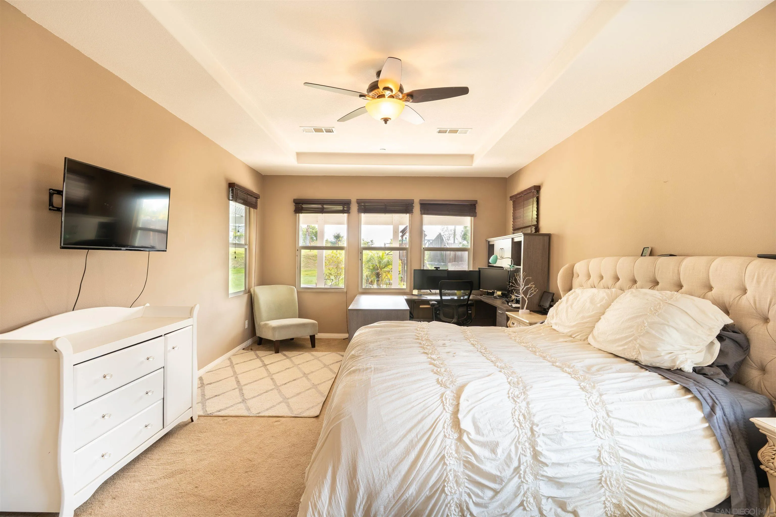 2352 Clearcrest Lane Fallbrook, CA 92028 - Photo 16 of 33 a spacious bedroom with a bed and a flat screen tv