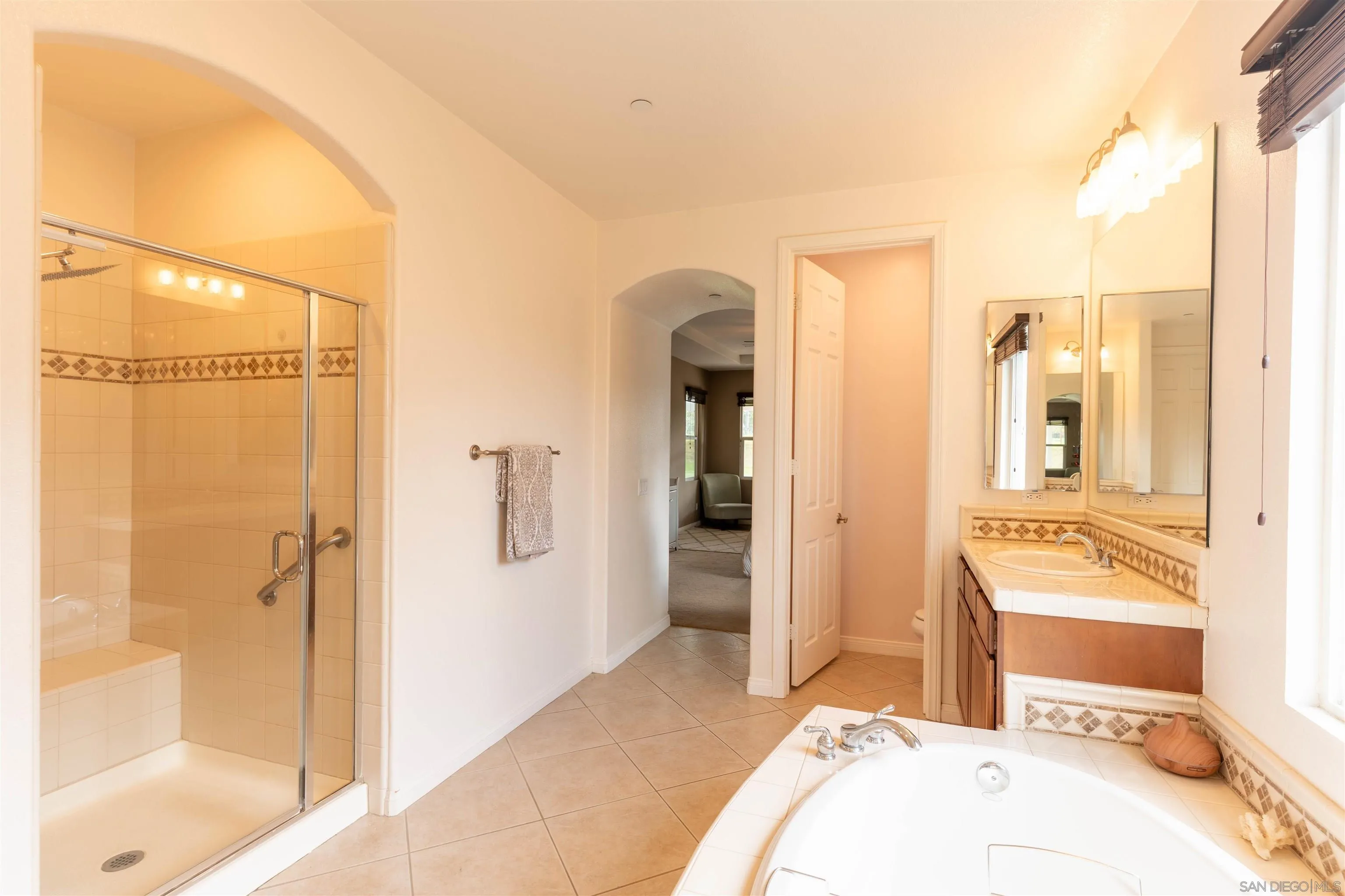 2352 Clearcrest Lane Fallbrook, CA 92028 - Photo 17 of 33 a bedroom with a bed and a mirror