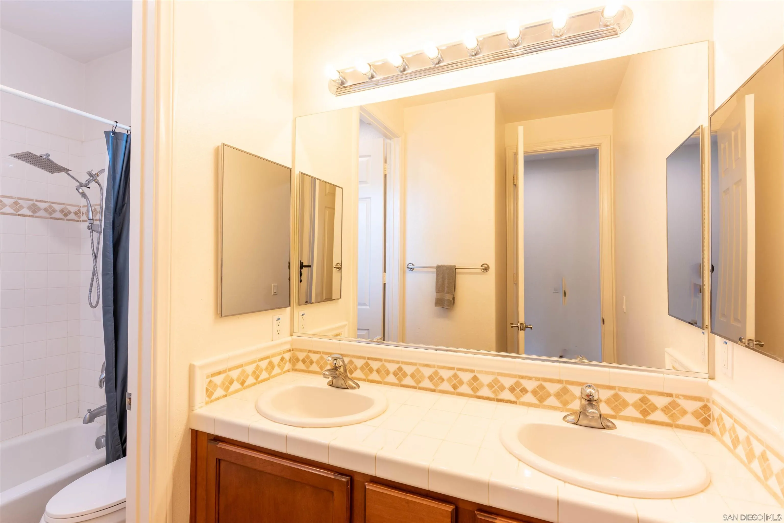 2352 Clearcrest Lane Fallbrook, CA 92028 - Photo 26 of 33 a bathroom with a sink and a mirror