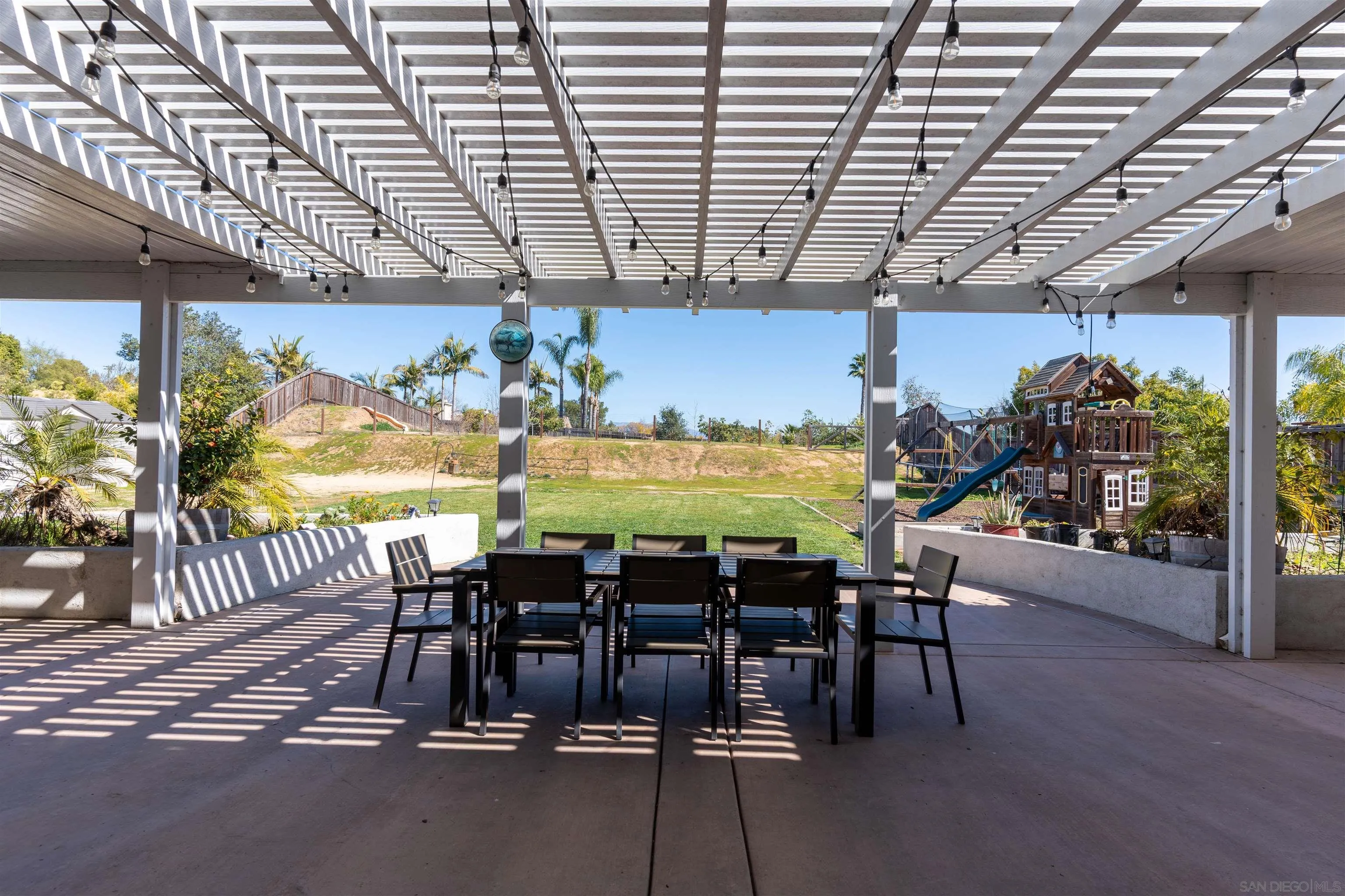 2352 Clearcrest Lane Fallbrook, CA 92028 - Photo 29 of 33 a view of a dining room with furniture wooden floor and chandelier