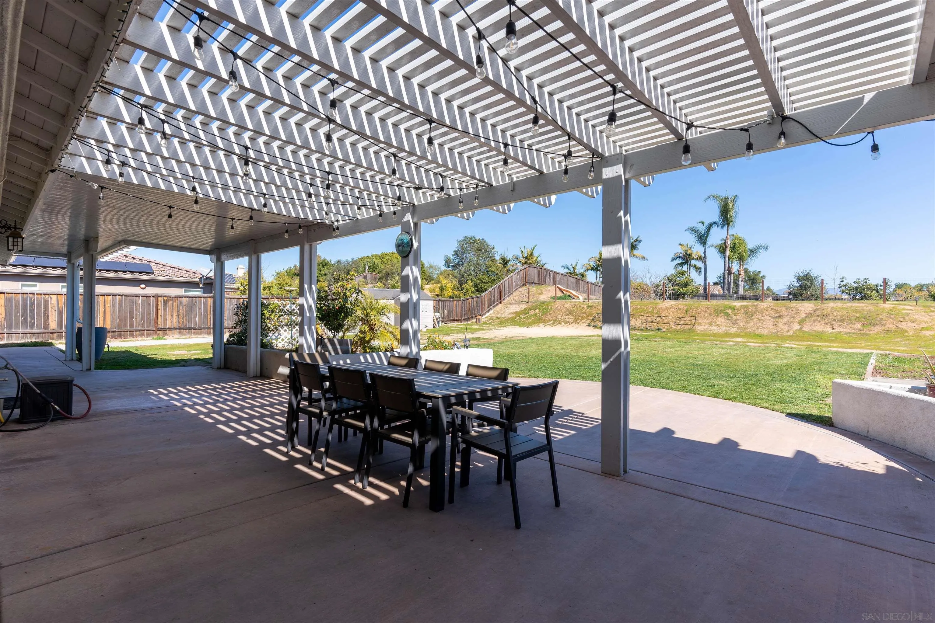 2352 Clearcrest Lane Fallbrook, CA 92028 - Photo 3 of 33 a view of a patio with table and chairs near an umbrella