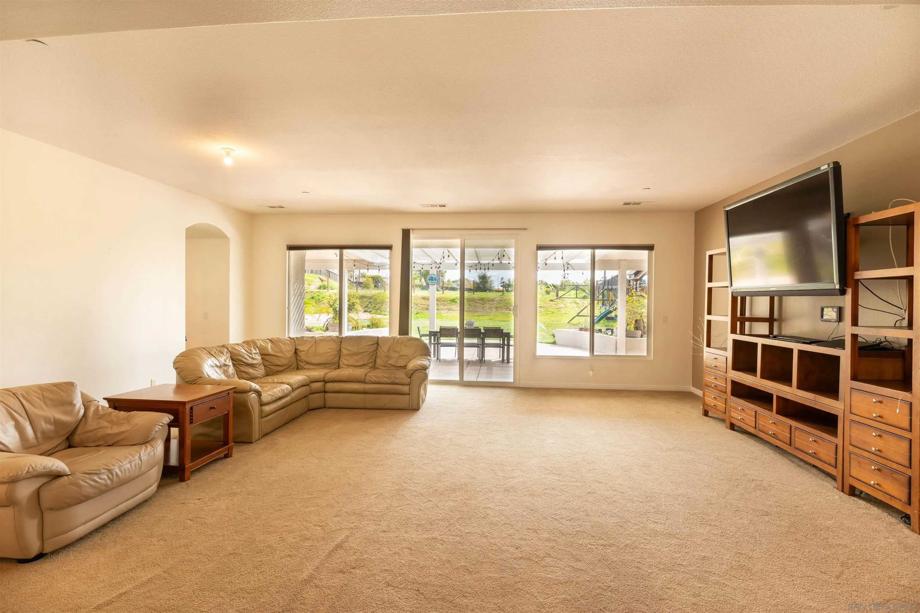2352 Clearcrest Lane Fallbrook, CA 92028 - Photo 7 of 33 a living room with furniture and a flat screen tv