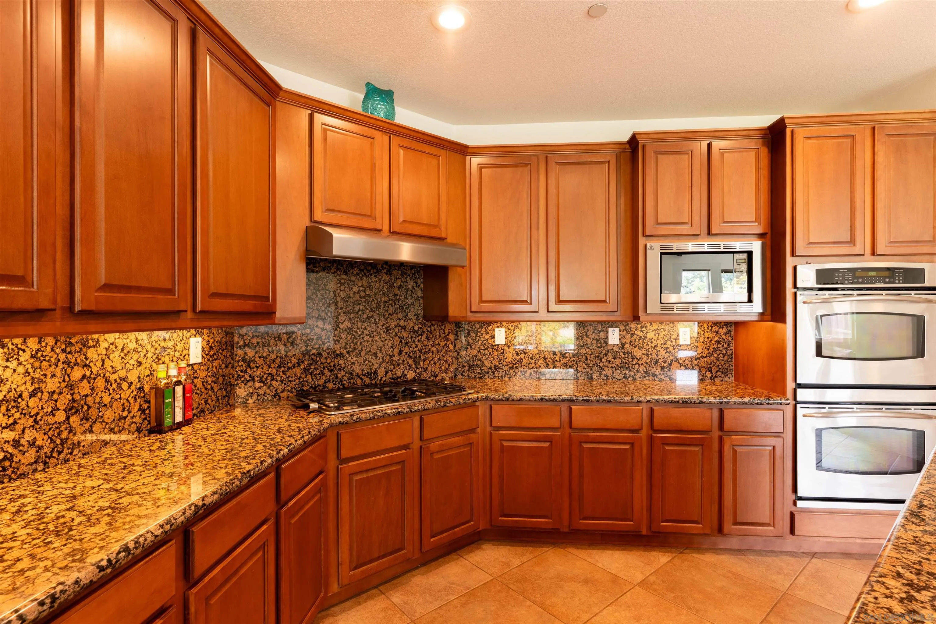 2352 Clearcrest Lane Fallbrook, CA 92028 - Photo 10 of 33 a kitchen with stainless steel appliances granite countertop a sink stove and cabinets