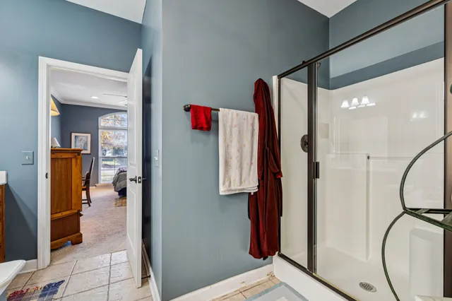 a dining room with furniture a chandelier and wooden floor