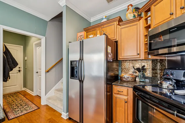 a bedroom with a bed and a chair in it