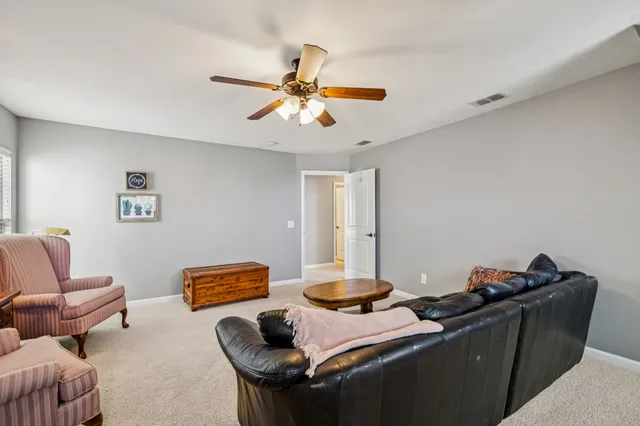 a view of a patio with table and chairs