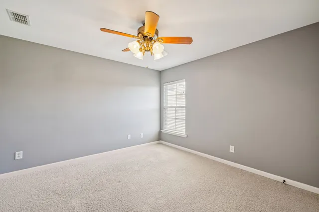 a wooden bench sitting in front of a building
