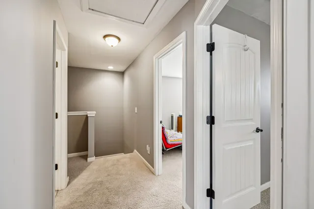 a view of a terrace with furniture and a floor to ceiling window