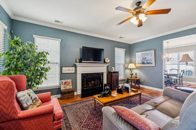 a view of a patio with table and chairs and potted plants