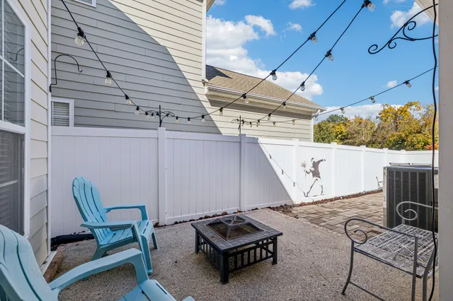a view of a yard with plants and trees