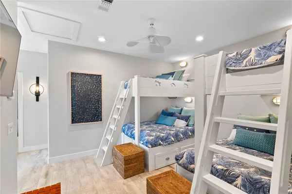 a bedroom with a bed chair and window