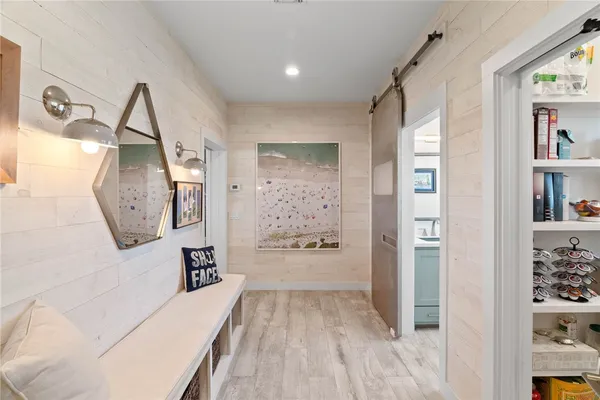 a kitchen with stainless steel appliances a stove a microwave and a refrigerator