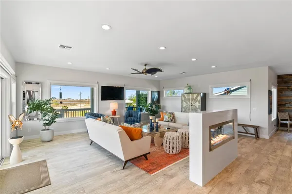 a large kitchen with a table and chairs