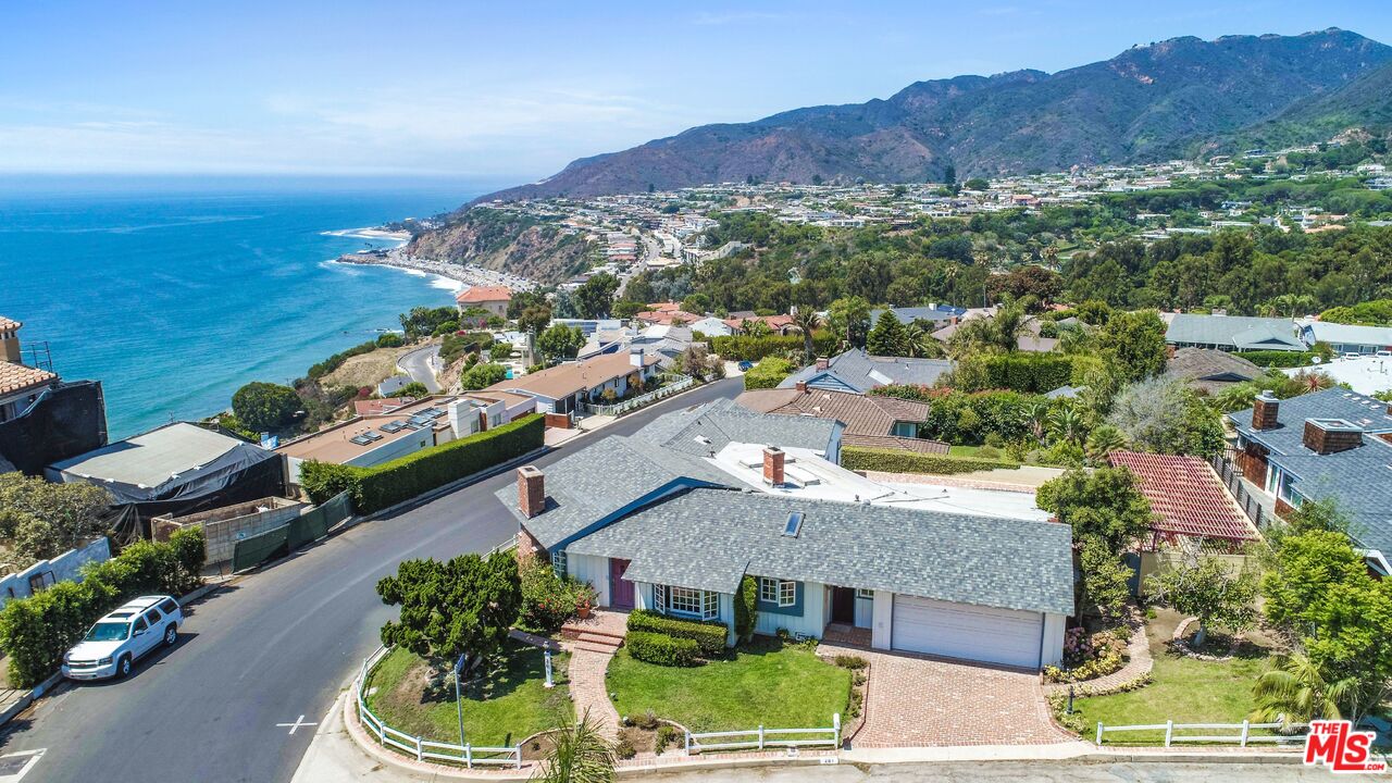 an aerial view of a house with a garden