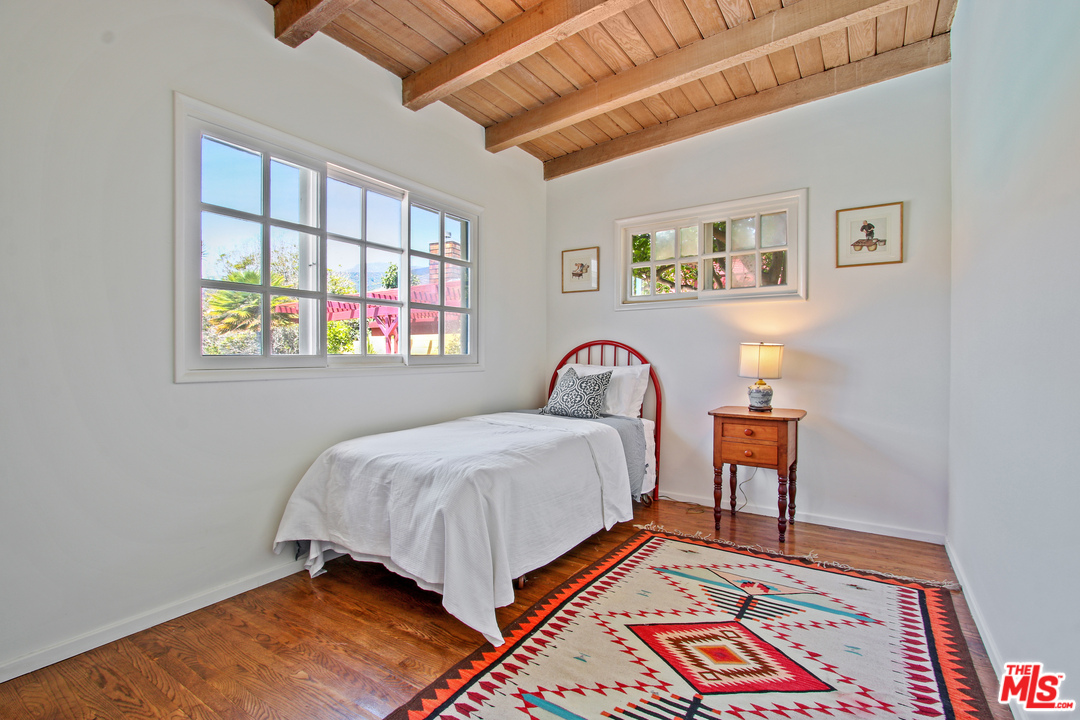 201 Tranquillo Road Pacific Palisades, CA 90272 - Photo 17 of 19 a bed room with a bed and a chair