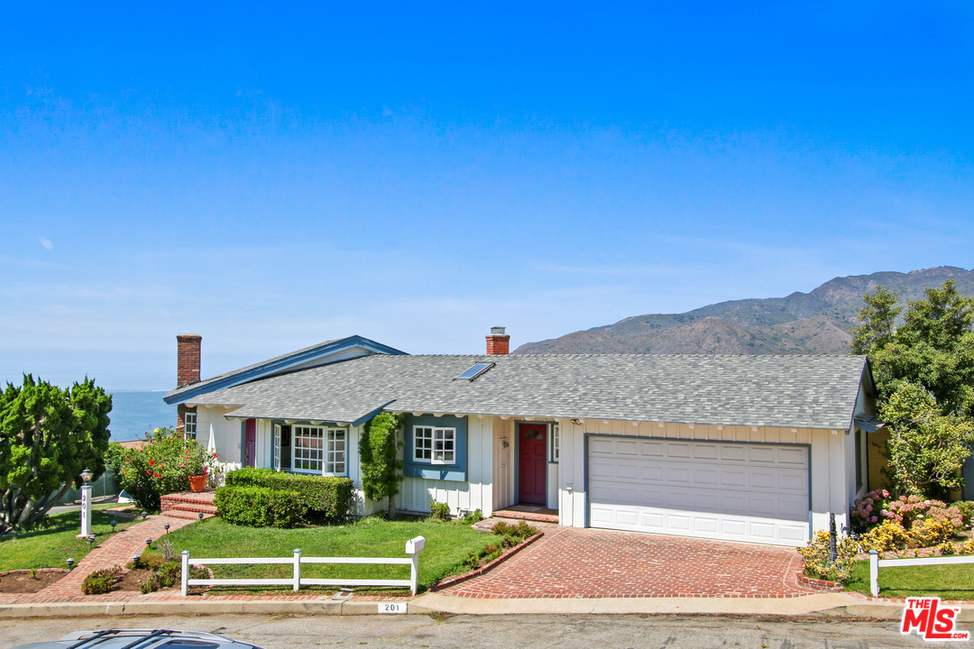 201 Tranquillo Road Pacific Palisades, CA 90272 - Photo 19 of 19 a front view of a house with a yard and garage