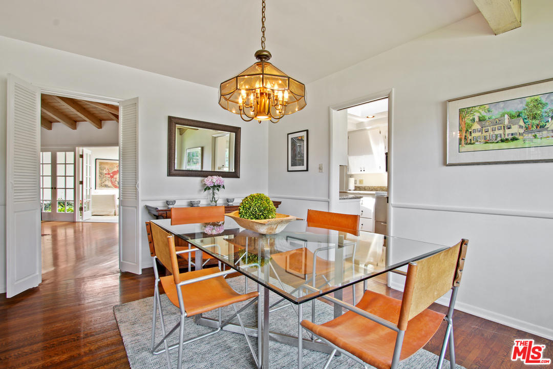 201 Tranquillo Road Pacific Palisades, CA 90272 - Photo 7 of 19 a view of a dining room with furniture and wooden floor