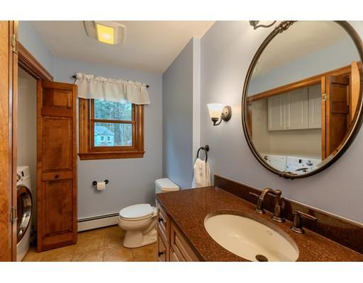 51 Groton Road Shirley, MA 01464 - Photo 12 of 30 a bathroom with a toilet a sink and mirror