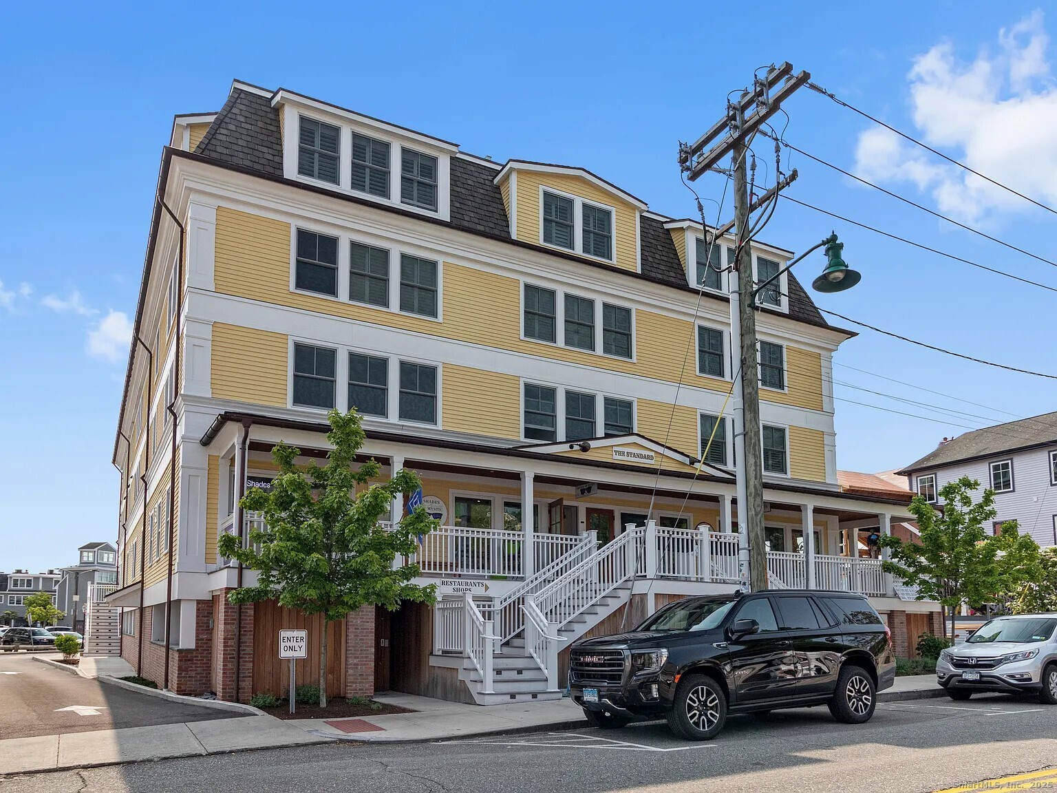 3 Water Street, Unit 305 Groton, CT 06355 - Photo 1 of 20 a car parked in front of a building