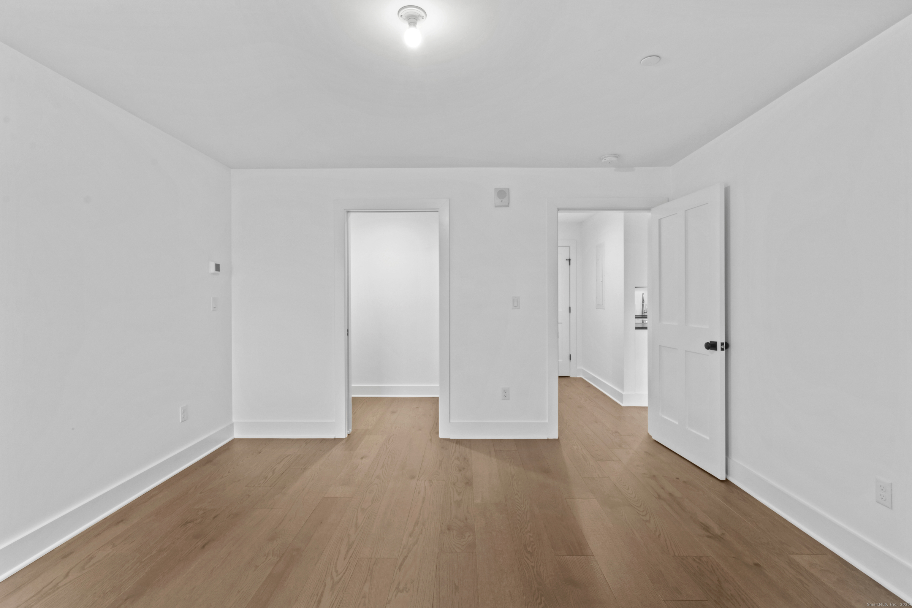 3 Water Street, Unit 305 Groton, CT 06355 - Photo 11 of 20 a view of an empty room with wooden floor
