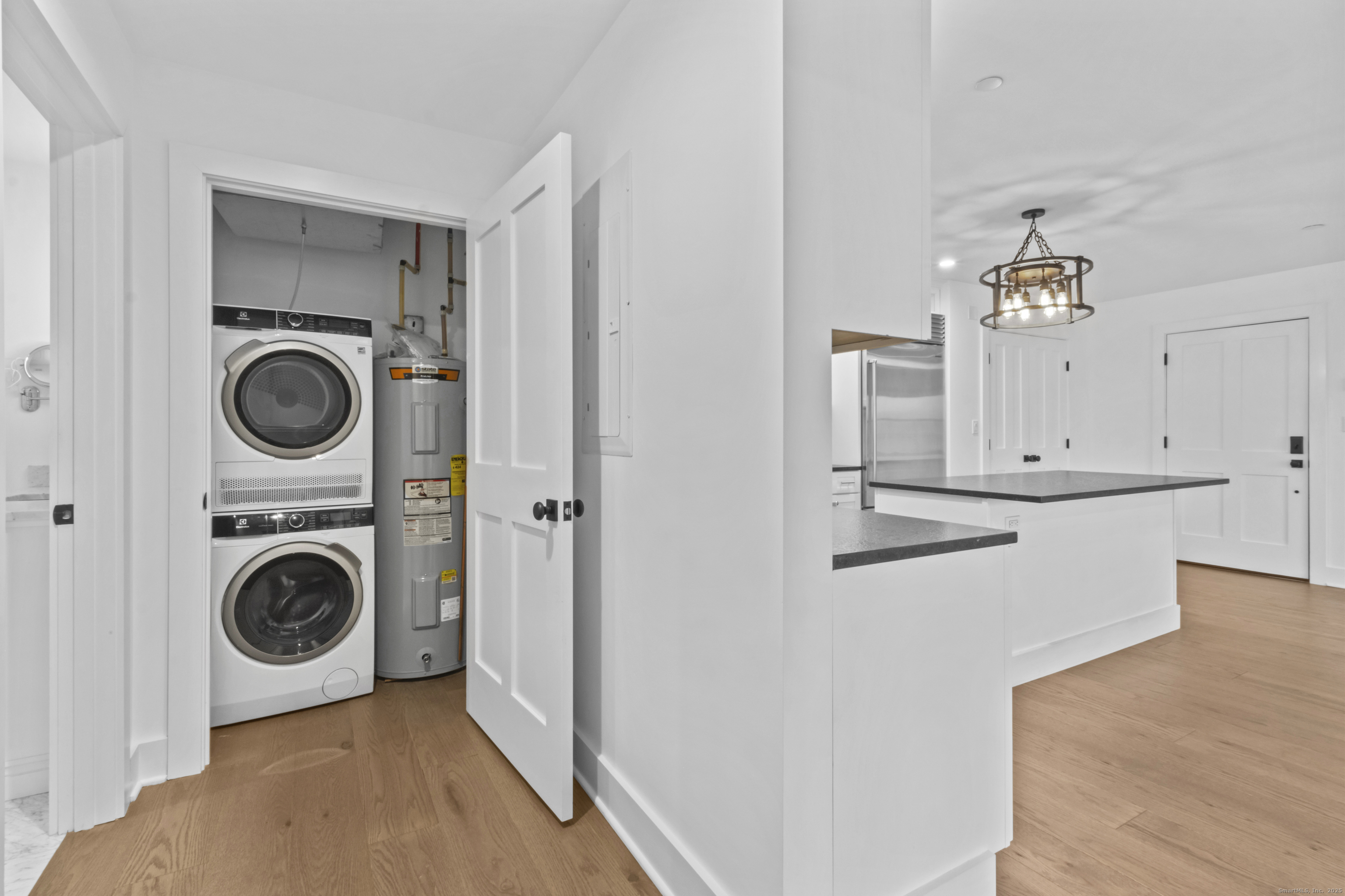3 Water Street, Unit 305 Groton, CT 06355 - Photo 12 of 20 a view of a kitchen with washer and dryer