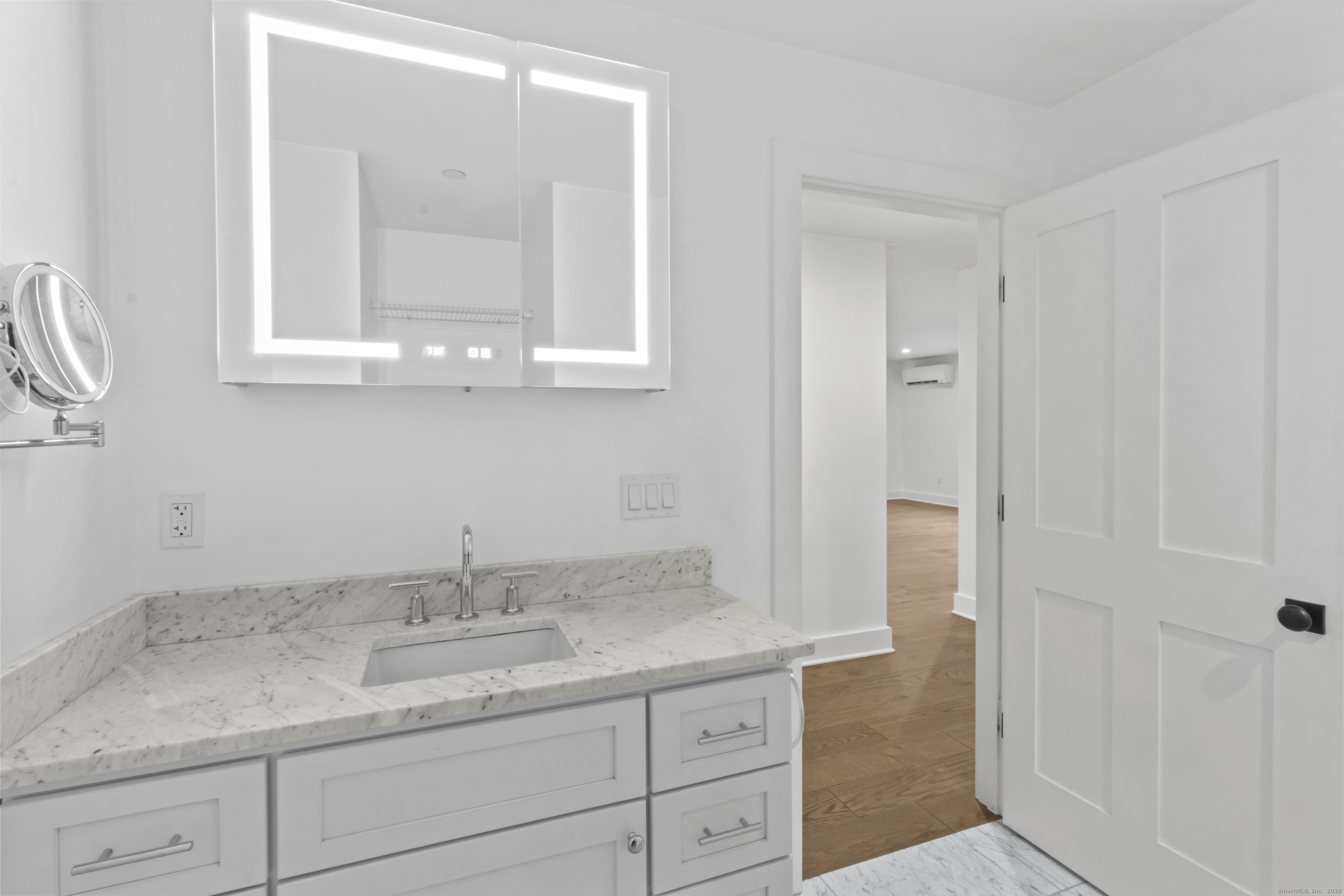 3 Water Street, Unit 305 Groton, CT 06355 - Photo 14 of 20 a bathroom with a granite countertop sink and a mirror