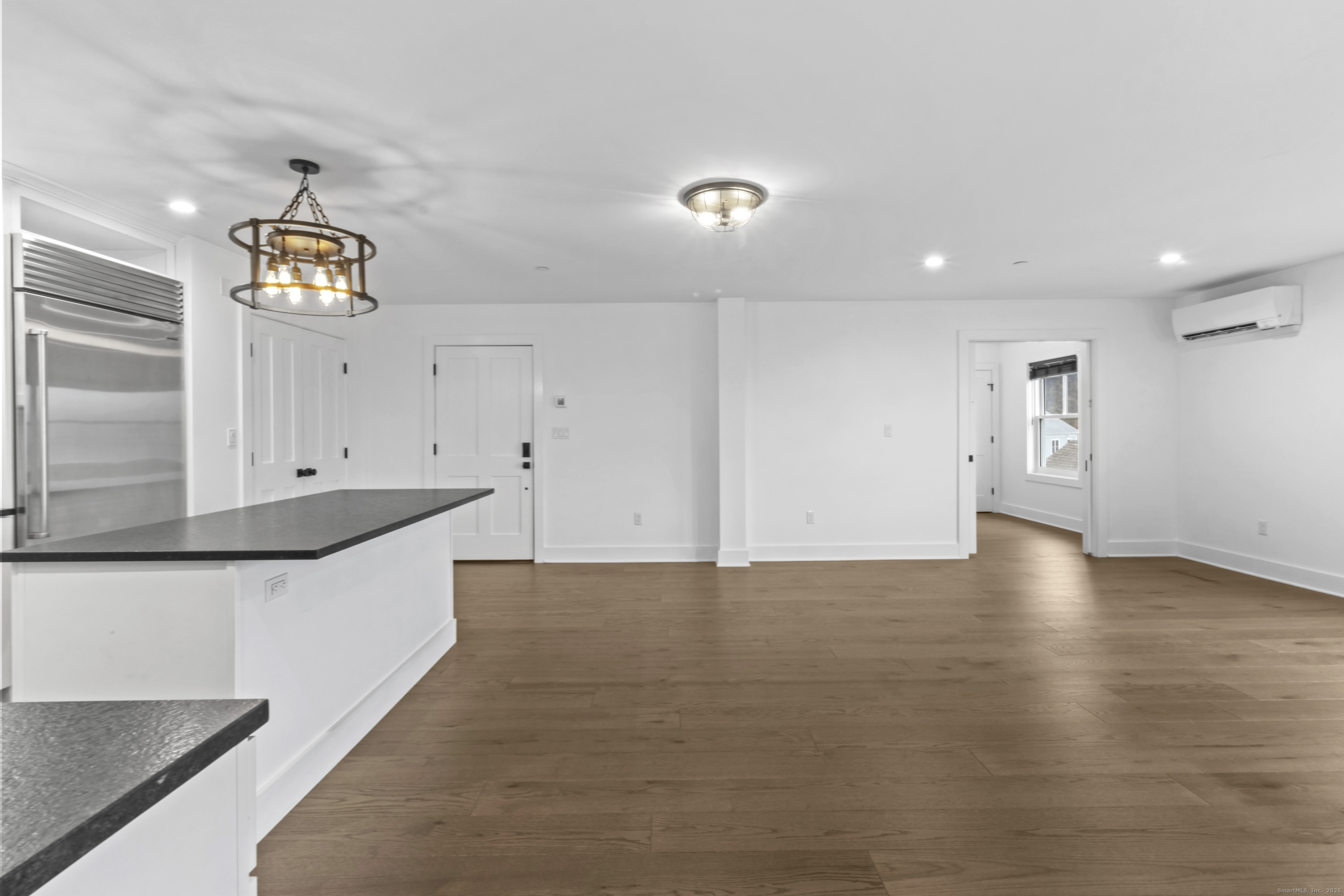 3 Water Street, Unit 305 Groton, CT 06355 - Photo 15 of 20 an empty room with cabinet and mirrors