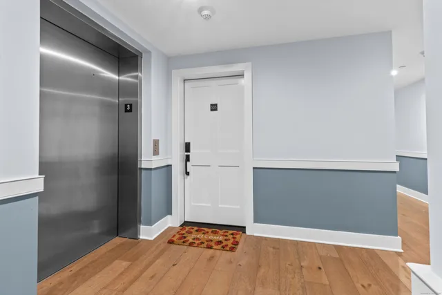 a picture of a bench in front of a wall