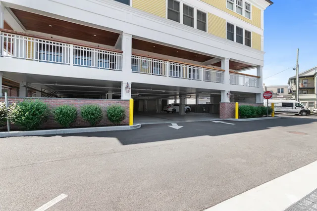 a view of a chairs and table in patio with a lake view
