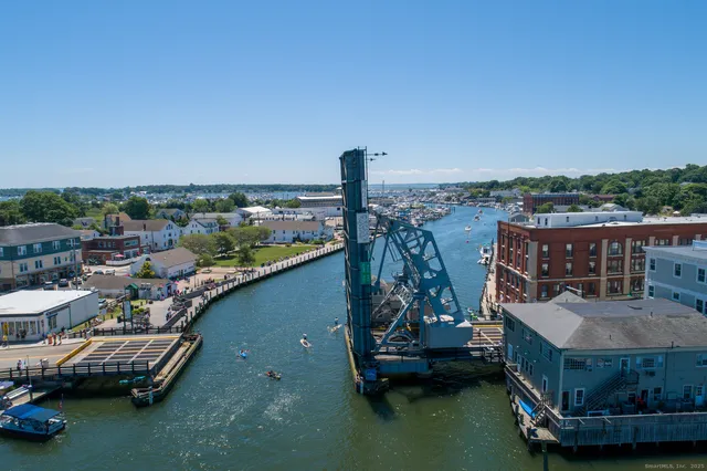 a view of a city that has tall trees