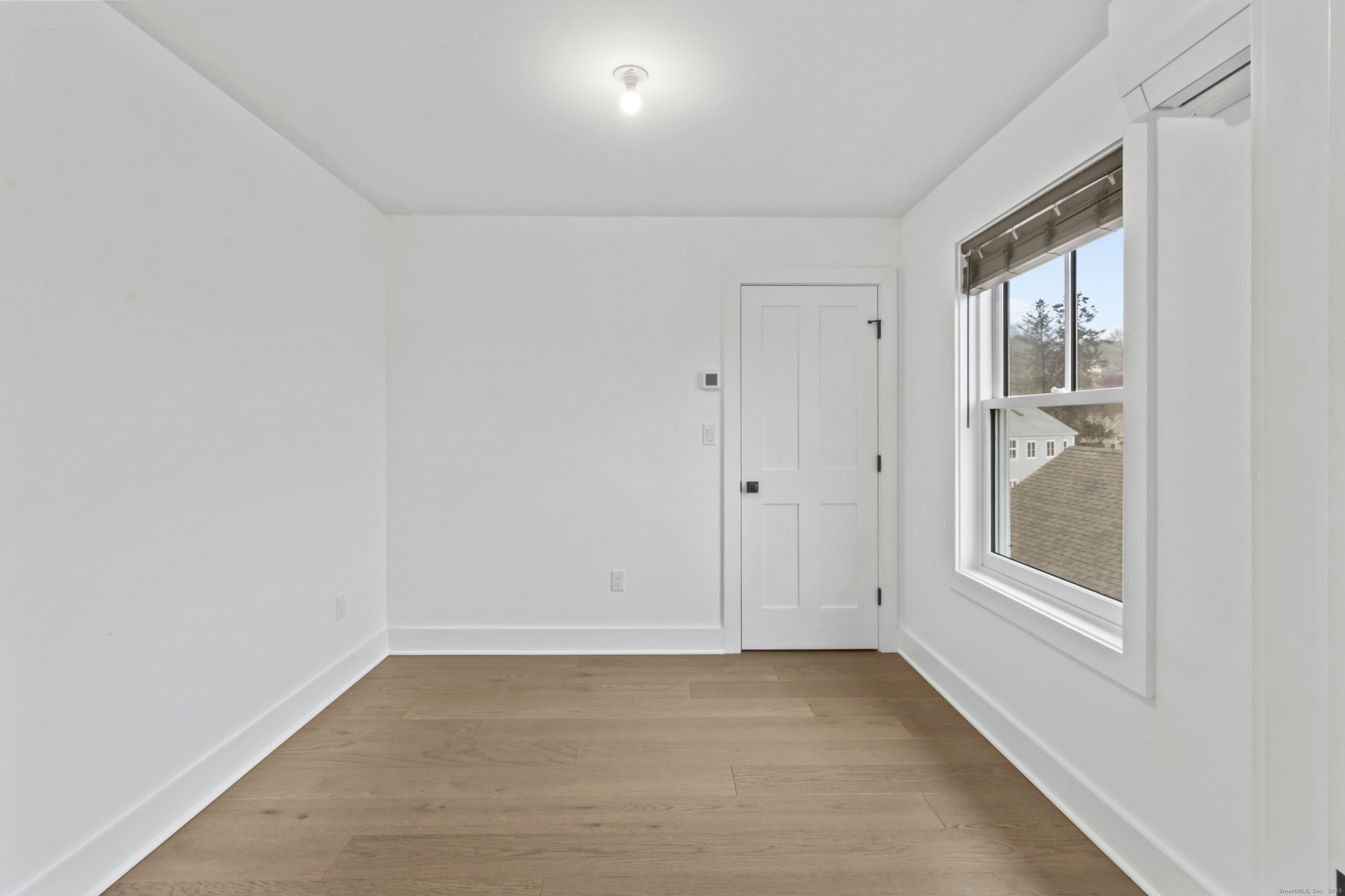3 Water Street, Unit 305 Groton, CT 06355 - Photo 8 of 20 a view of an empty room with a window