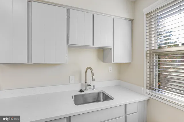 a bedroom with a bed and a chair