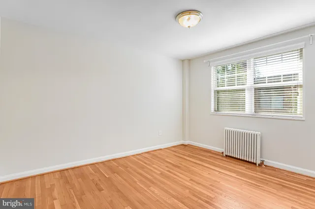 a bathroom with a shower a toilet and sink