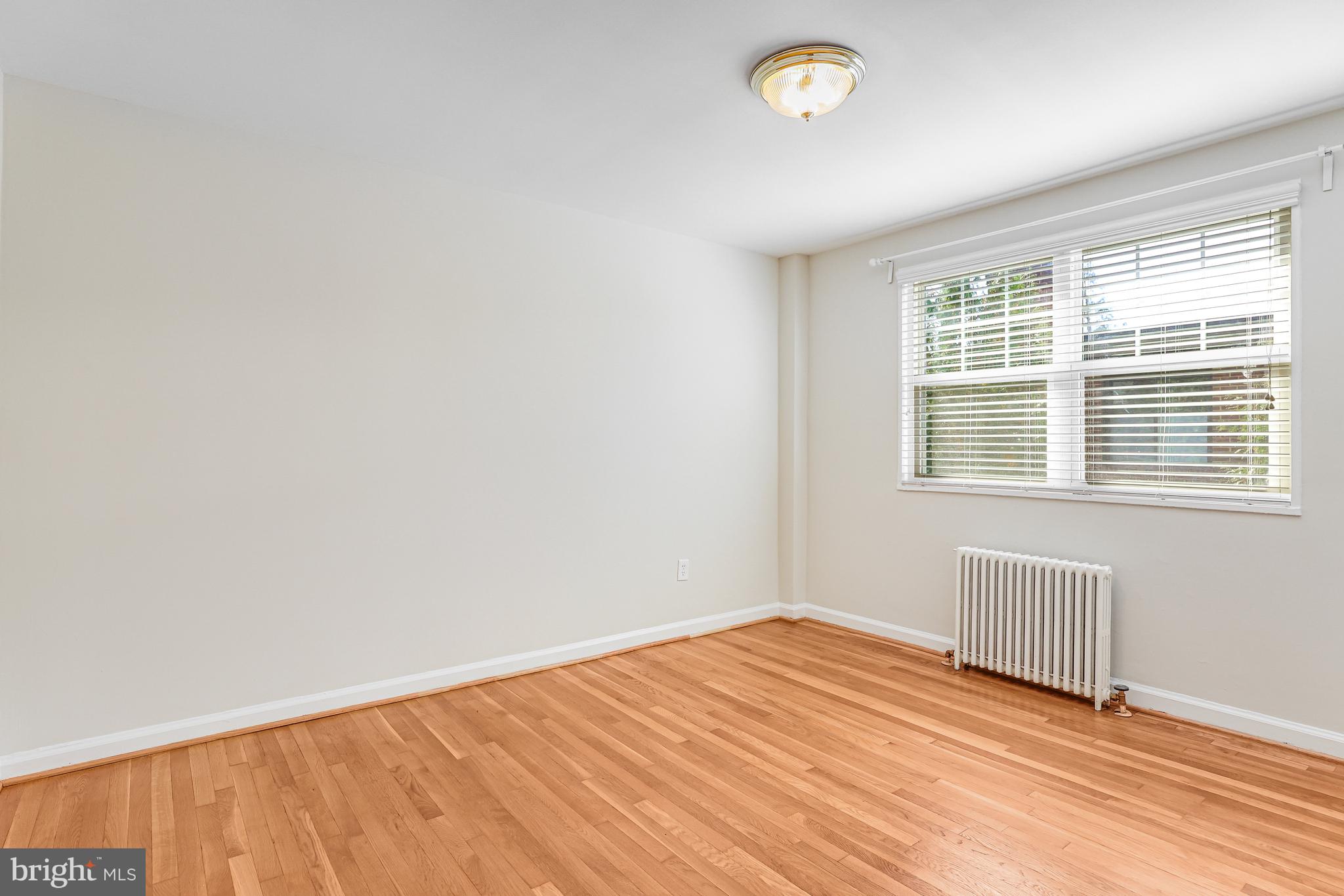 1404 12th Street North, Unit 32 Arlington, VA 22209 - Photo 16 of 26 a view of an empty room with a window
