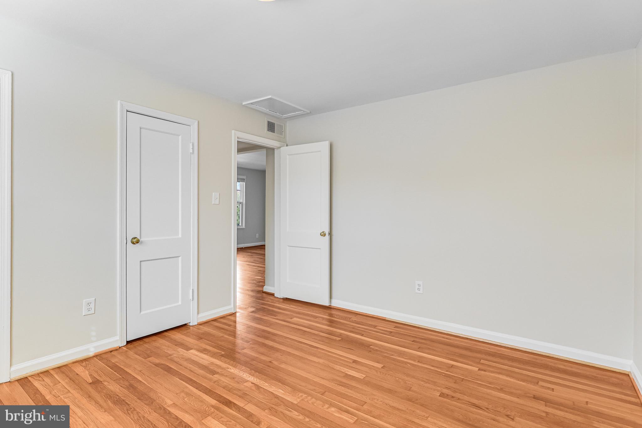 1404 12th Street North, Unit 32 Arlington, VA 22209 - Photo 17 of 26 a view of empty room with wooden floor