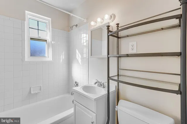 a bathroom with a bathtub and a sink
