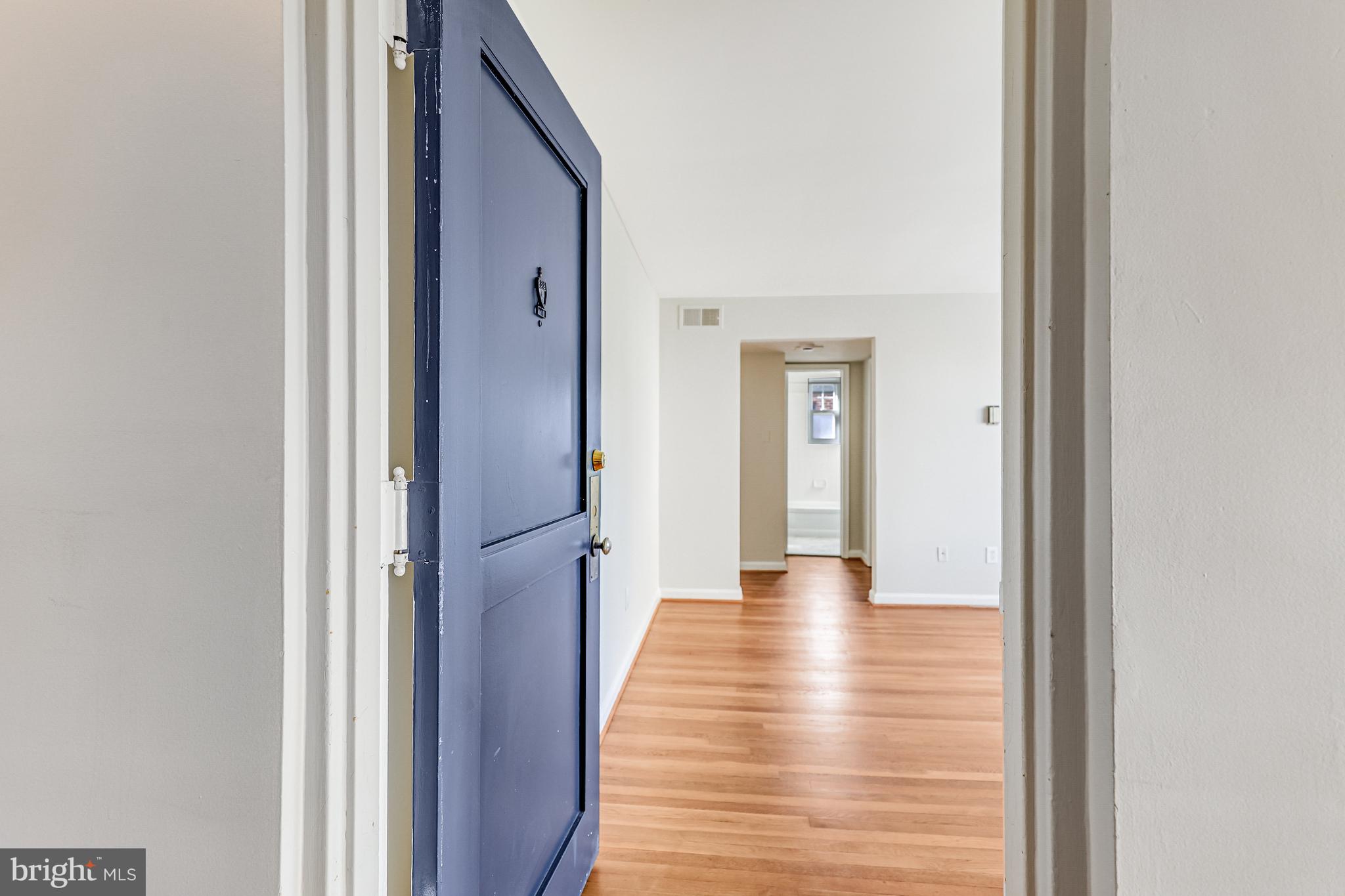 1404 12th Street North, Unit 32 Arlington, VA 22209 - Photo 4 of 26 a view of a hallway with wooden floor